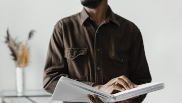 close up blind man reading braille